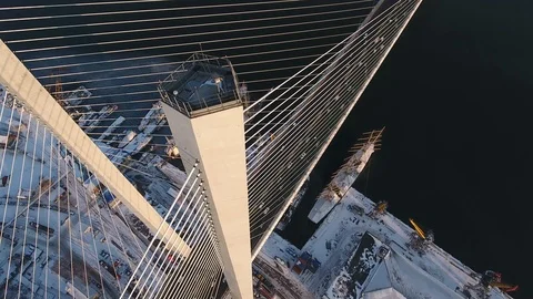 Aerial Golden cable-stayed bridge Pylon Road traffic Horn Bay Vladivostok Winter Stock Footage 92977762