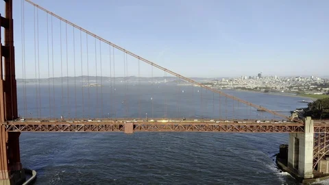 Aerial of Golden Gate Bridge flying parallel golden hour, 4K Stock Footage 106954223