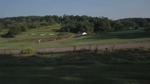 Aerial of golfer on par three Stock Footage 79967231