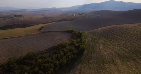 Aerial, gorgeous tuscan fields landscape near the city of Volterra Video stock 94607575