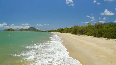 Aerial, gorgeous view on the ocean waves in Clifton Beach in Cairns, Queensla Stock-Footage 112951630