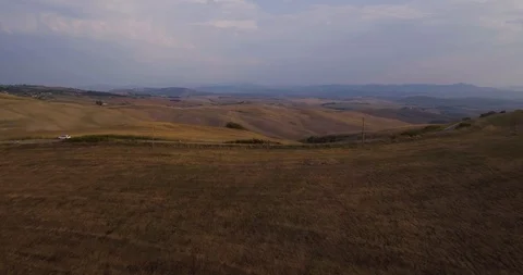 Aerial, gorgeous view on the road in the middle of plowed fields landscape in Stock-Footage 102551629