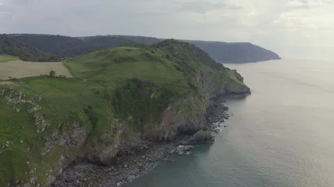 Aerial of granite Valley of Rocks on Devon Coast, England Video stock 251035033