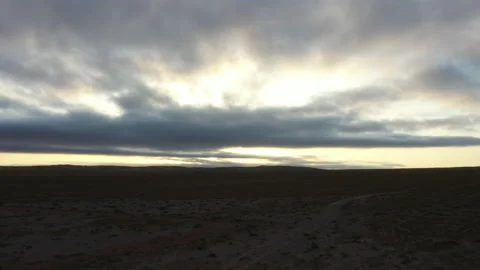 Aerial: grassy landscape with cloudy sky Stock Footage 149289301