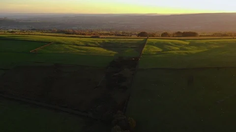 Aerial of green patchwork fields at sunset Stock-Footage 102188008