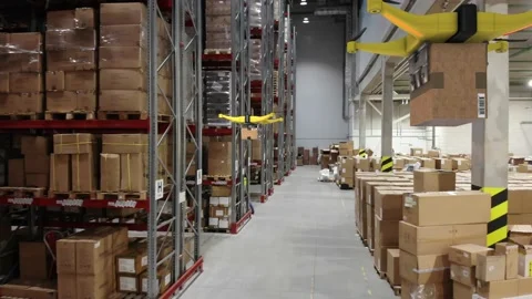 AERIAL. Group of delivery drones flights inside huge warehouse. Drone deliveries Stock Footage 149456527