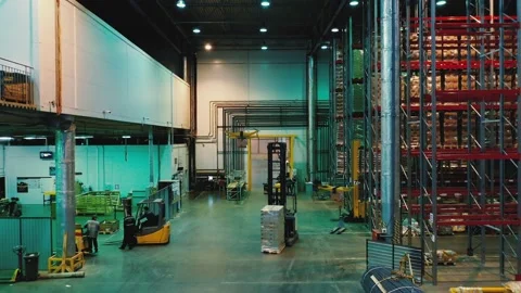 AERIAL. Group of delivery drones flights inside huge warehouse. Drone deliveries Stock Footage 149456751