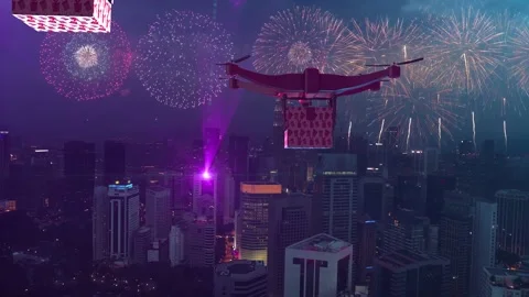 AERIAL. Group of drones delivery new year's gifts in the big city with fireworks Stock Footage 166436669