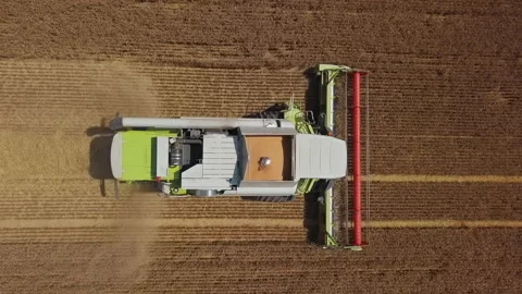Aerial of harvester in action Video stock 135933754