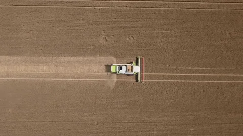 Aerial of harvester in action Stock Footage 150954872