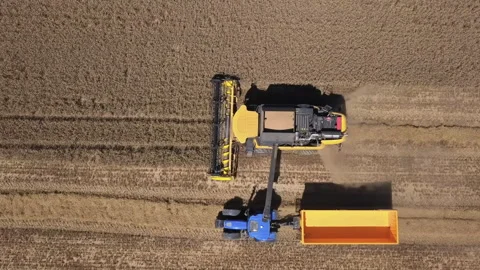 Aerial of harvester in action Stock Footage 231437656