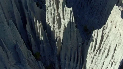 Aerial: Haunting cliffs at Putangirua Pinnacles, Cape Palliser, New Zealand Stock Footage 163973482