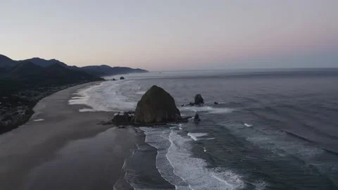 Aerial Haystack Rock and Cannon Beach Coastline at Dusk Oregon 4K Stock Footage 209986123