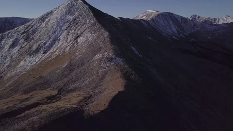Aerial HD Drone Flying an Alpine Mountain Peak Ridgeline at Sunrise Stock Footage 85064136