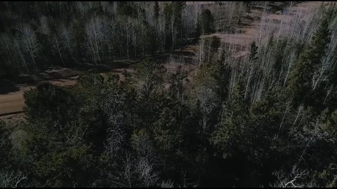 Aerial HD Drone Tracking Dark SUV on a Mountain Dirt Road Curve Stock Footage 84986040