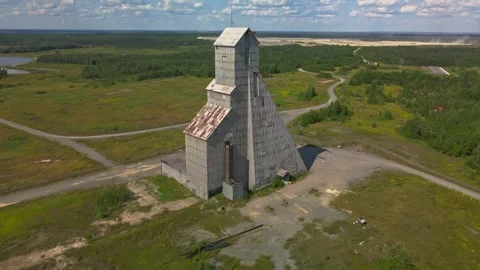 Aerial of headframe starting mid tower rising up looking down Stock Footage 254908814