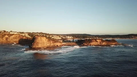 Aerial of headlands surrounded by ocean Stock Footage 88669619