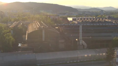 AERIAL: Heavy industry factory zone in front of residential condo buildings city Stock Footage