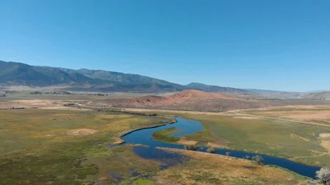 Aerial-Heavy Spring runoff causes small river to flood its banks-pov Video stock 112361203