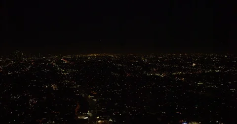 Aerial helicopter shot of fireworks exploding in the distance, night 스톡 동영상 102020424