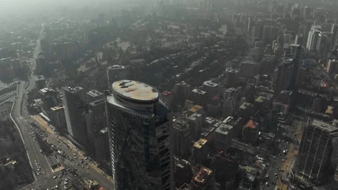 Aerial of helicopter taking off of a skyscraper rooftop in Santiago de Chile Stock Footage 121596969