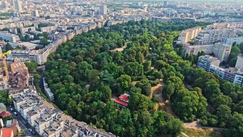 Aerial high angle drone view of Parc des buttes chaumont in Paris cityscape at Stock-Footage 341075030