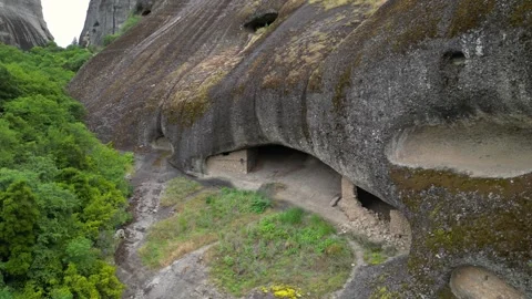 Aerial High Angle Fly Backwards Meteora, Greece Hermit Caves of Badovas. An.. Stock Footage 334898047