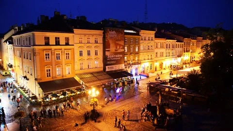 Aerial high angle night view on old town market square, people in Lviv Ukraine Stock Footage 112653254