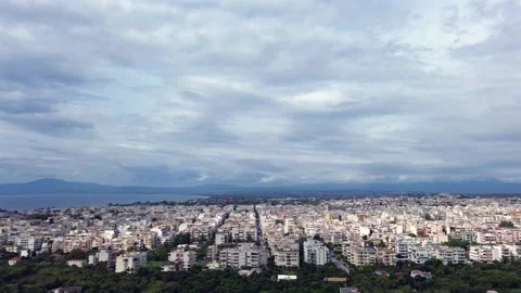 Aerial high angle, parallax orbital footage , Kalamata cityscape with a view to Stock Footage 320890972