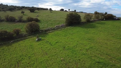 Aerial high angle of person walking downhill path in rural hillside Stock Footage 337459795