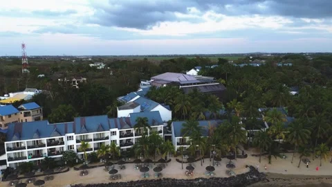 Aerial high angle shot of a luxury beachfront resort, sandy cove, and priva.. Stock Footage 340876318
