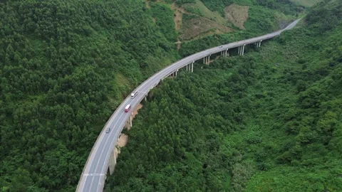 Aerial High Angle Shot Overlooking Traffic on Viaduct Bridge in Vietnam. 库存影片 345147535