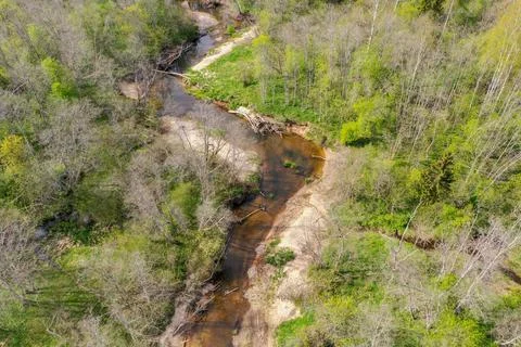 Aerial high angle view of bendy river in spring Stock Photos