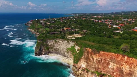 Aerial High Angle View of Coastal Village and Ocean Reef Stock Footage 340659052
