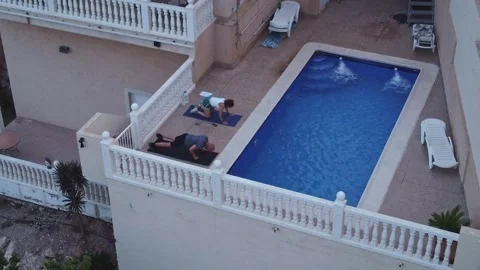 Aerial High Angle View of Couple Doing Bodyweight Push Ups and Donkey Kicks by Stock Footage 345386037