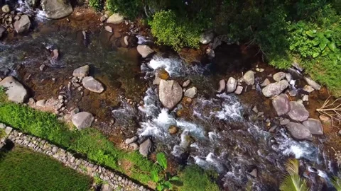 Aerial High Angle View of Crystal Clear Mountain River Flowing Over Rocks Видео 331710816