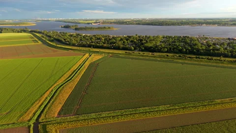 Aerial high angle view of geometric agricultural fields with drainage canal. Stock Footage 340106087