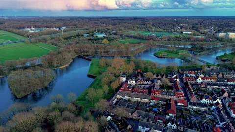 Aerial high angle view of a historic Dutch star fort town featuring Stock Footage 338252846