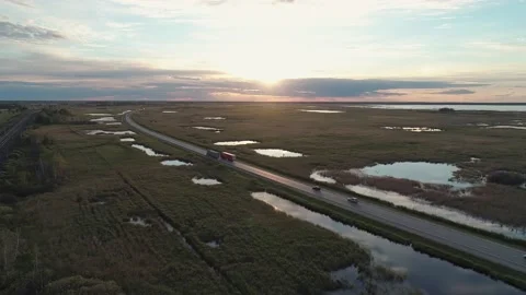 Aerial high angle view of an intercity road with traffic and railway between Video stock 209140792
