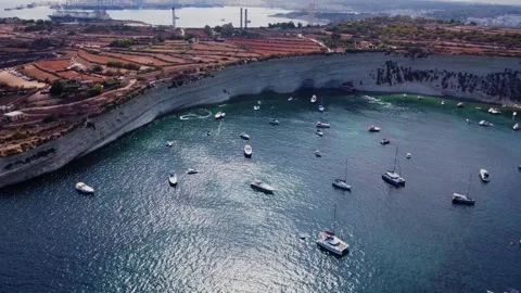 Aerial high angle view of a limestone headland separating two scenic bays f.. Stock Footage 325801536