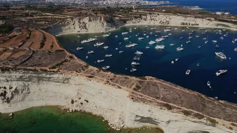 Aerial high angle view of a limestone headland separating two scenic bays f.. Stock Footage 325801539