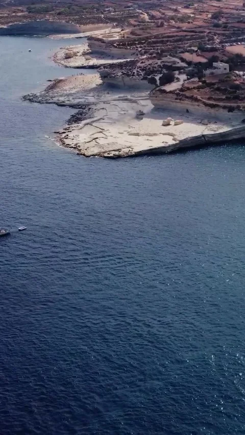 Aerial high angle view of a limestone headland separating two scenic bays f.. Stock Footage 327034624