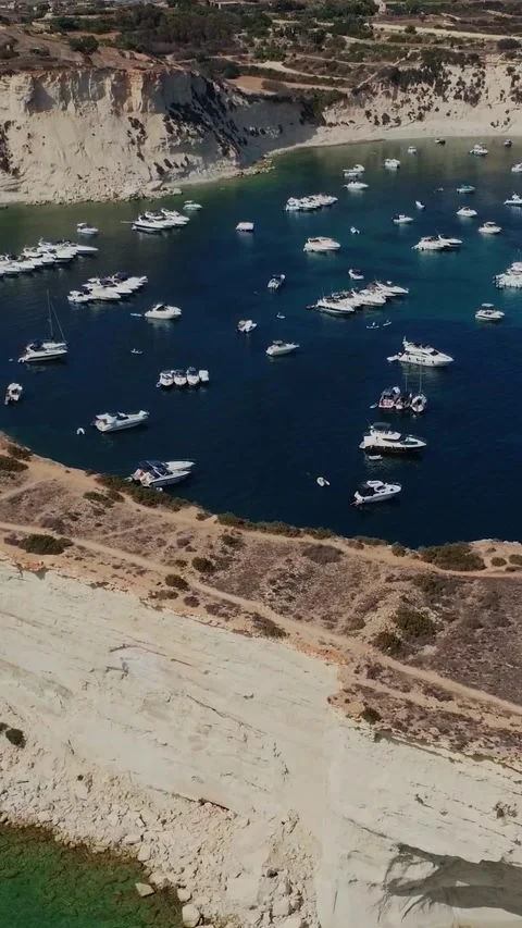 Aerial high angle view of a limestone headland separating two scenic bays f.. Stock Footage 327034630