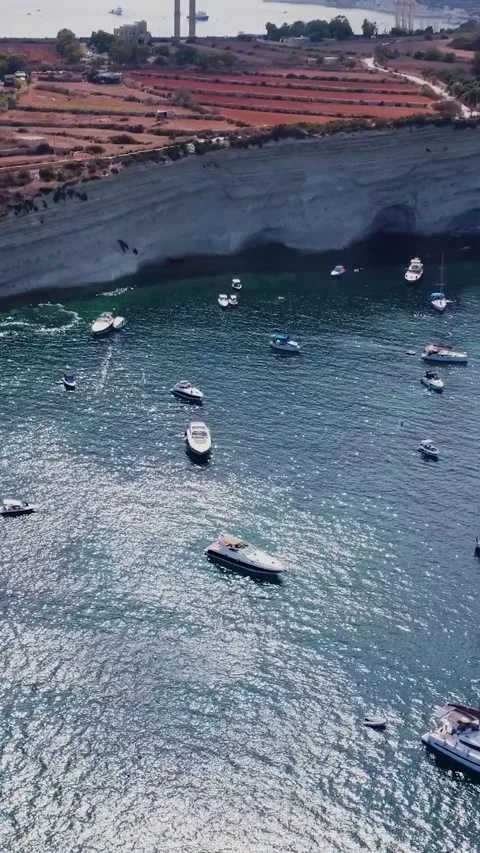 Aerial high angle view of a limestone headland separating two scenic bays f.. Stock Footage 327034633