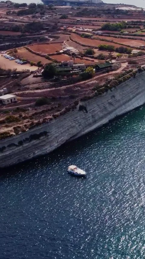 Aerial high angle view of a limestone headland separating two scenic bays f.. Stock Footage 327034636