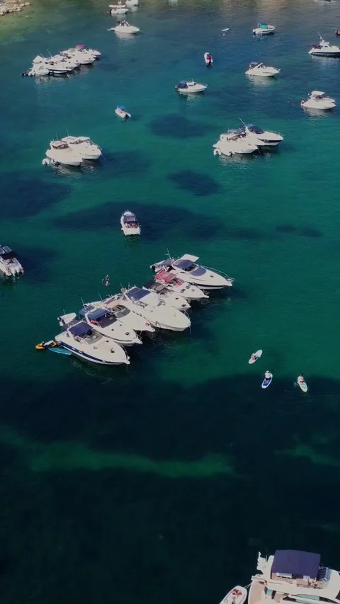 Aerial high angle view of a limestone headland separating two scenic bays f.. Stock Footage 327034680