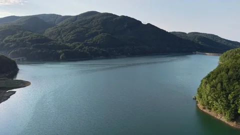 Aerial High Angle View of Majestic Mountain Lake and Deep Forest Valleys Stock Footage 345484817