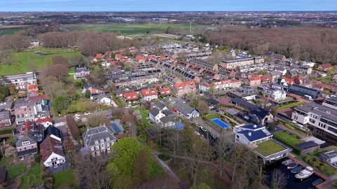 Aerial high angle view of a modern Dutch residential neighborhood with solar Stock Footage 332444575