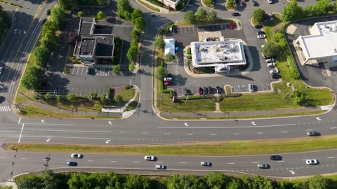 Aerial High-Angle View Moving Over Street and Commercial Parking Lots Stock Footage 346734139