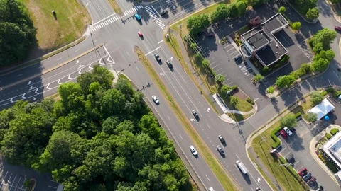 Aerial High-Angle View Moving Over Road Intersection and Commercial Property Stock Footage 346734140